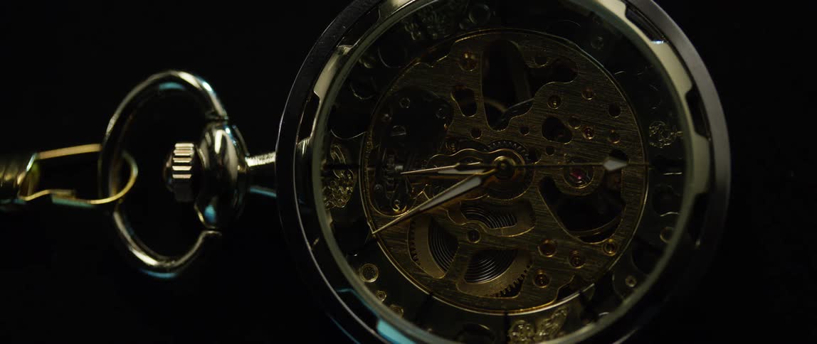 Second hand moving clockwise on a pocket watch