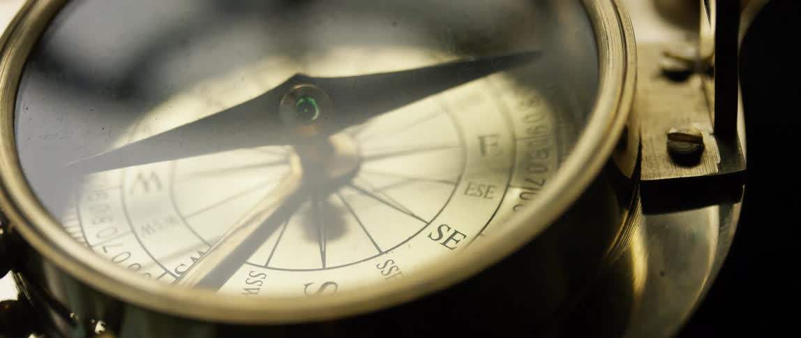 A compass finds direction with a needle pointing to magnetic north