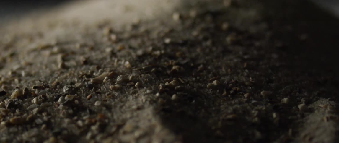 Small granules slide across a surface