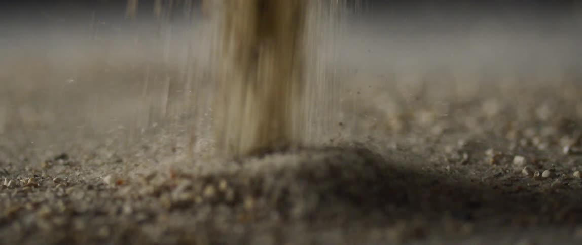 Sand is poured into a pile