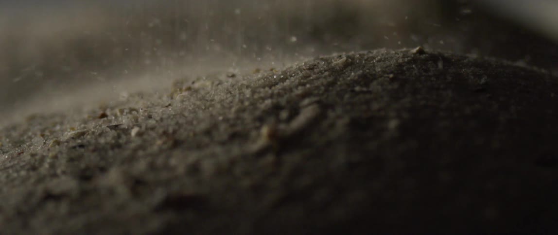 Dust or dirt piling up in a container