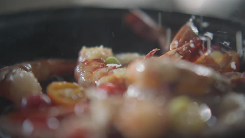 Seafood cooking on a hot frying pan