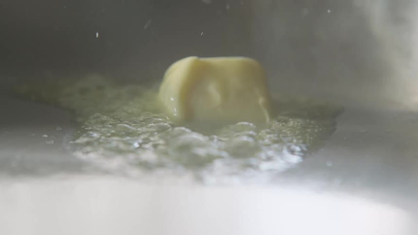 Butter sizzling and melting in a hot pan