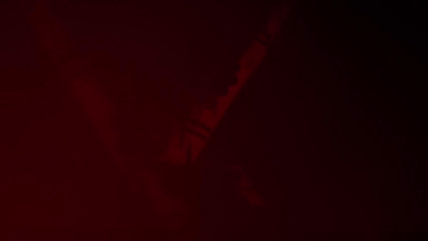 A light changes from a yellow to red hue