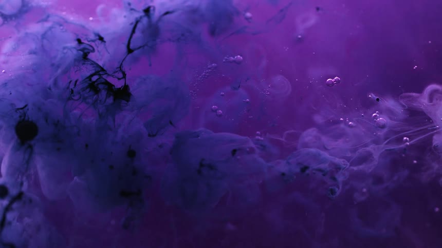 The darker ink mixes with the purple