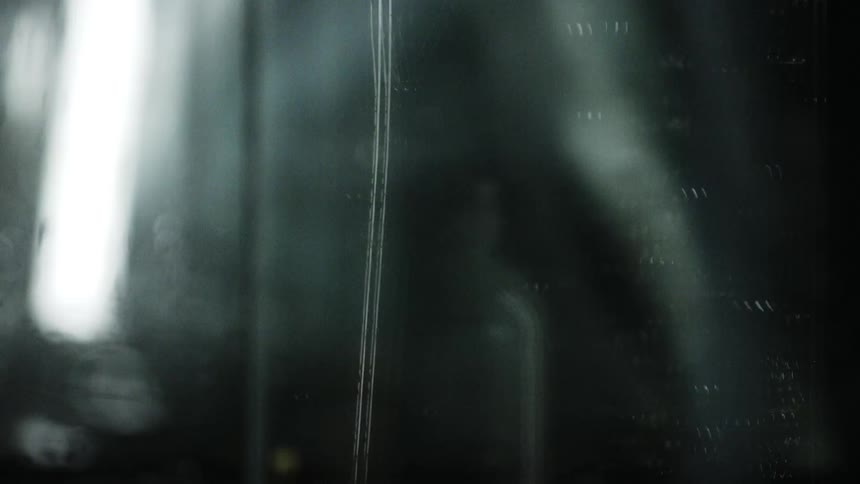 Lights are swinging in front of the mirror