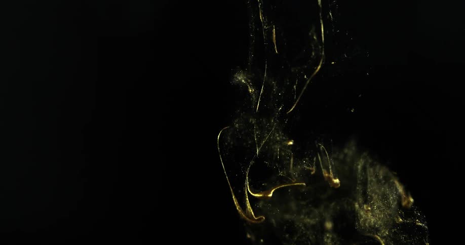 Gold paint sinking in liquid