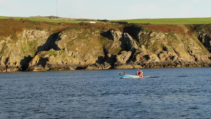 A person on a boat on the lake