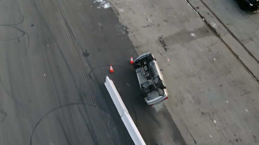 A car driving up a ramp then tumbling
