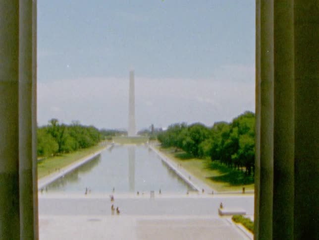The washington monument and the reflecting pool in the national mall caught on film