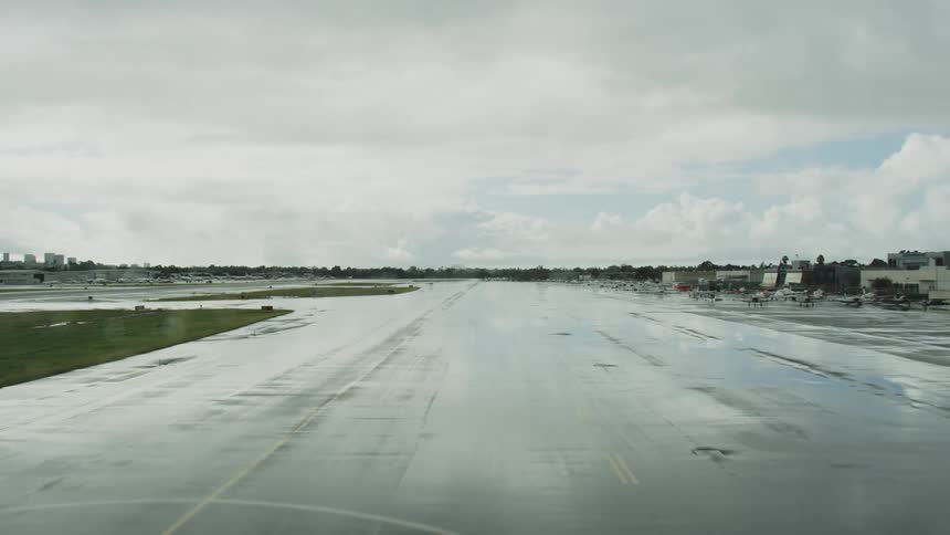 Airplanes parked along a runway at an airport