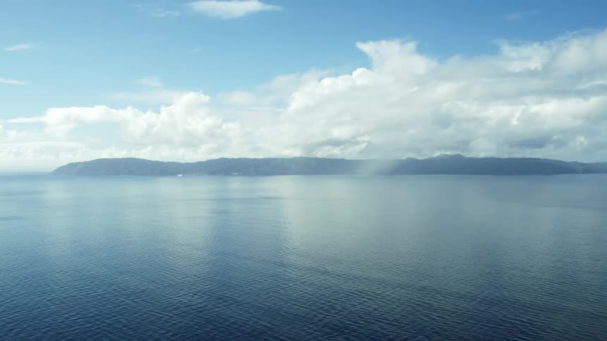 A ocean is displayed at midday