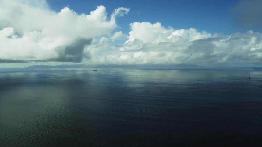A boat is in the middle of a calm ocean