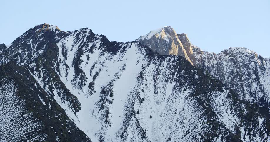 The top of a snow covered mountain