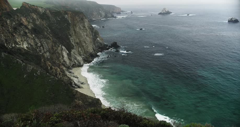 The small waves crash against the shore