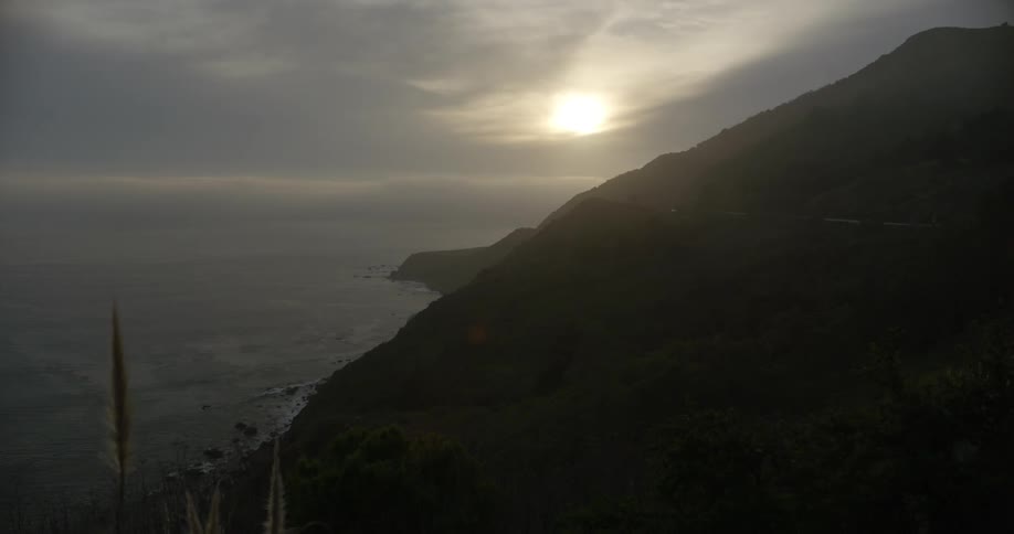 Tall cliffs above ocean at dawn