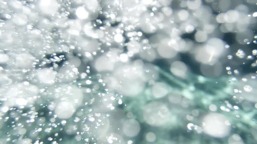 Underwater footage of air bubbles floating to the surface