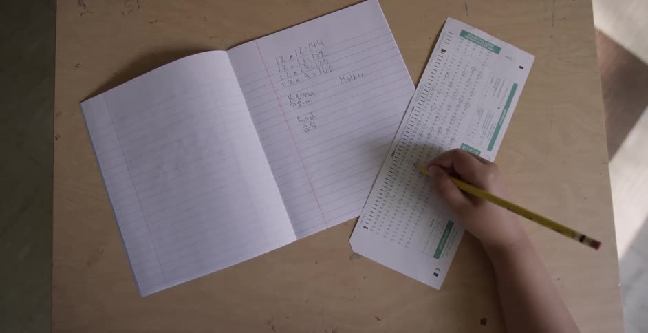 A child fills in a test paper