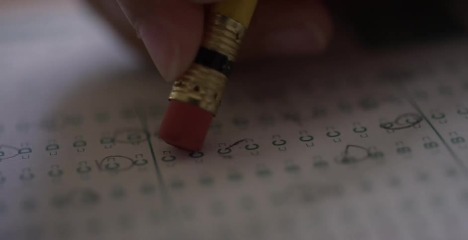 A student erases a circle from a multiple choice test