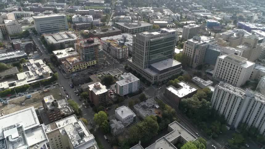 An aerial view of a downtown city is displayed