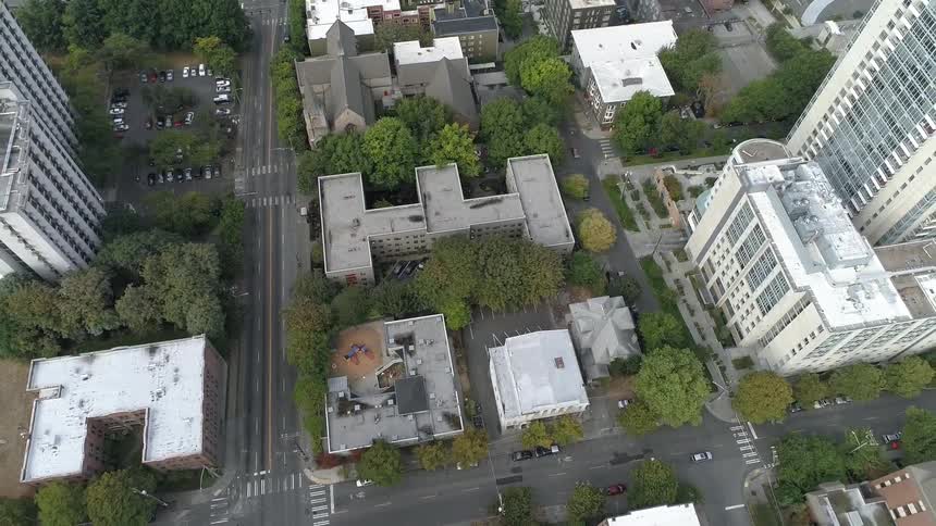 An aerial view of a downtown city is displayed