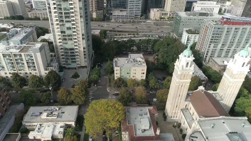 An aerial view of a downtown city is displayed