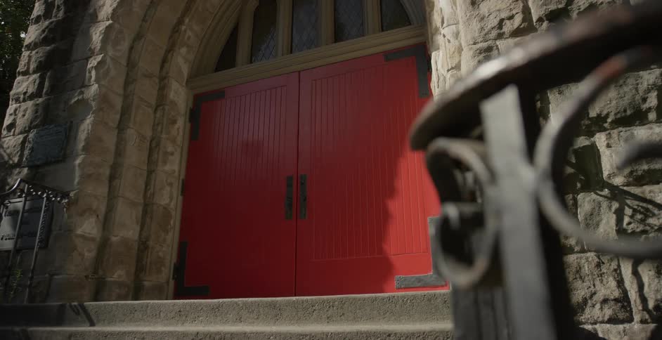 A large door on a stone building in a city