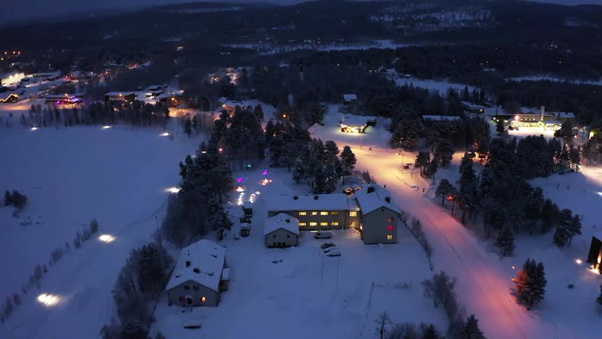 Residential area at night with snow on the ground