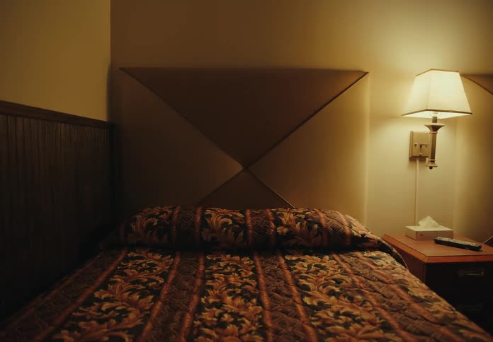 A bed in a hotel room