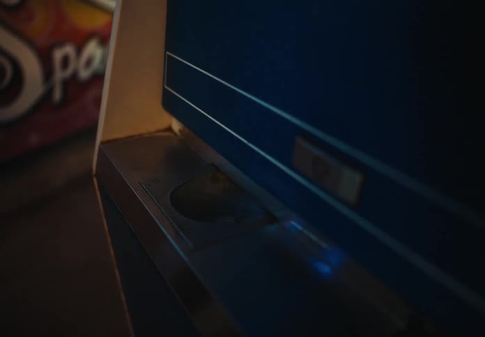 A person taking change from a change machine