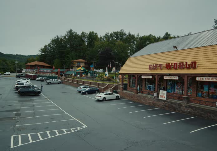 Parking lot in a convenience store close to a mini golf in a small town