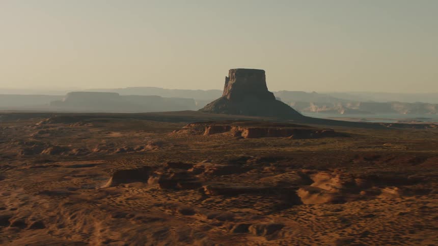 The long desert leads to fog covered mountains