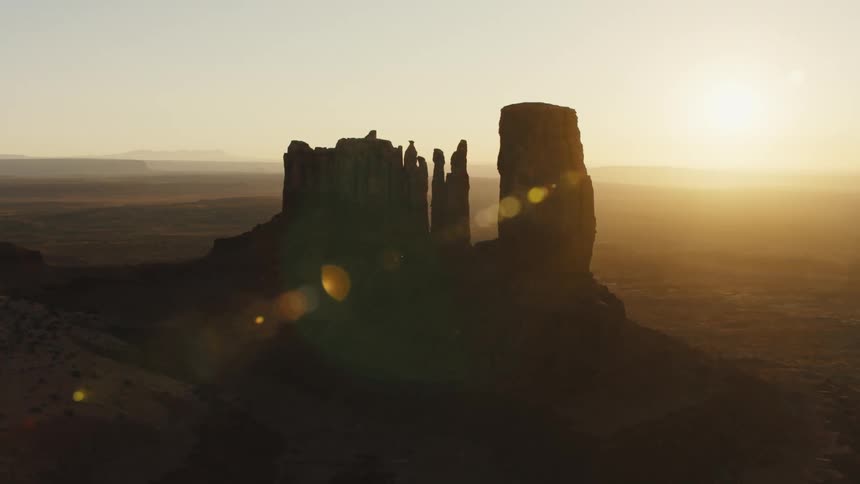Large rock formations in the landscape as the sun sets