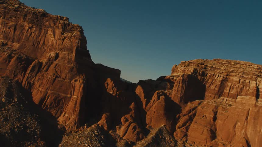 A mountain formation is displayed at dusk