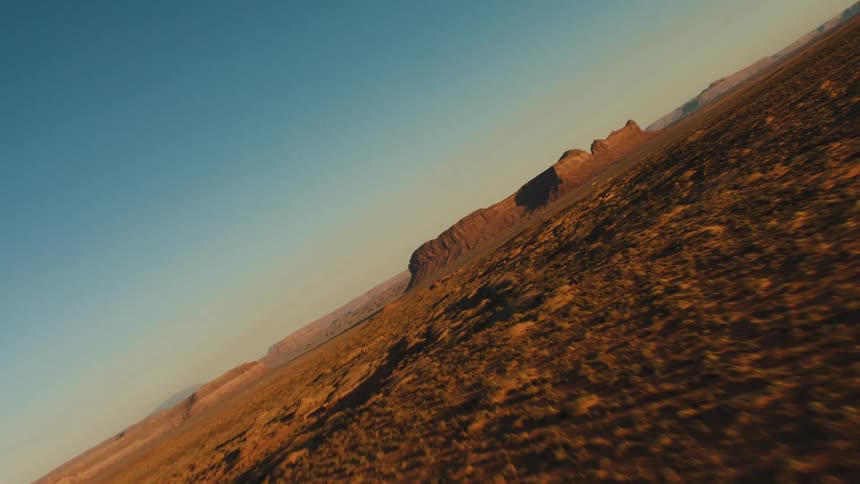 Aerial view mesas in the desert badlands at sunset
