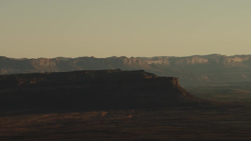The cliffs in the canyon give off shade to the desert
