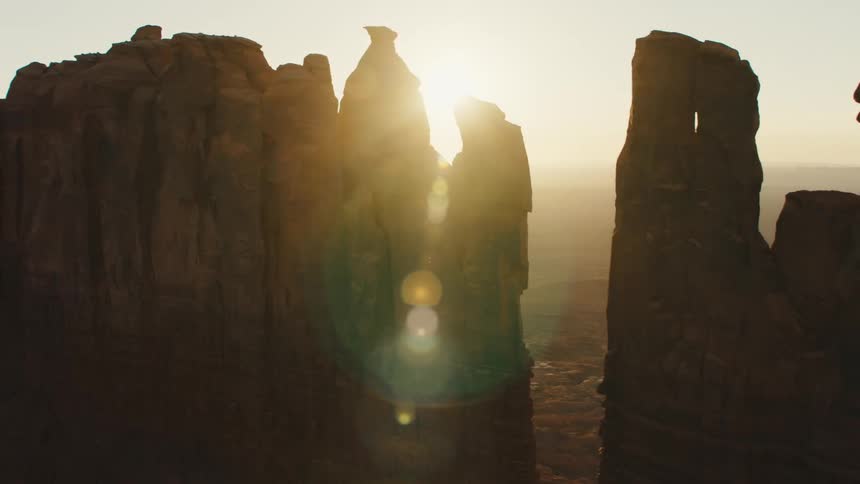 A tall wall like rock formation in the badlands on a sunny day