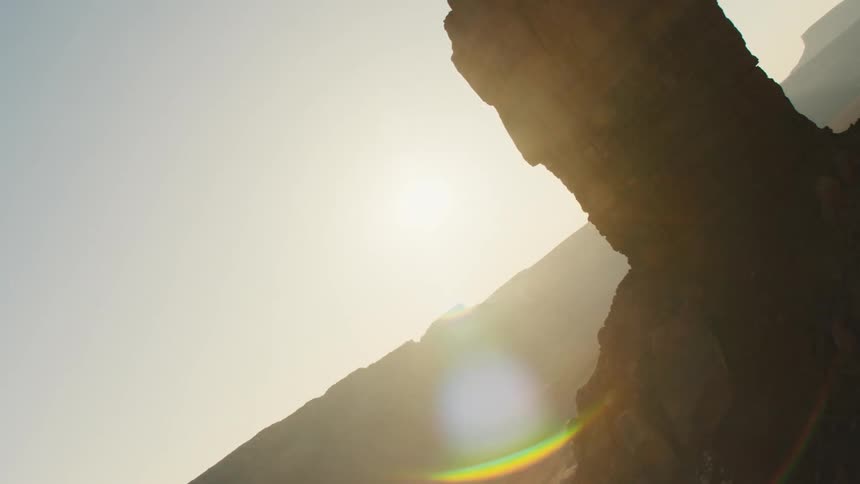Aerial view of a rock formation in the desert at sunset