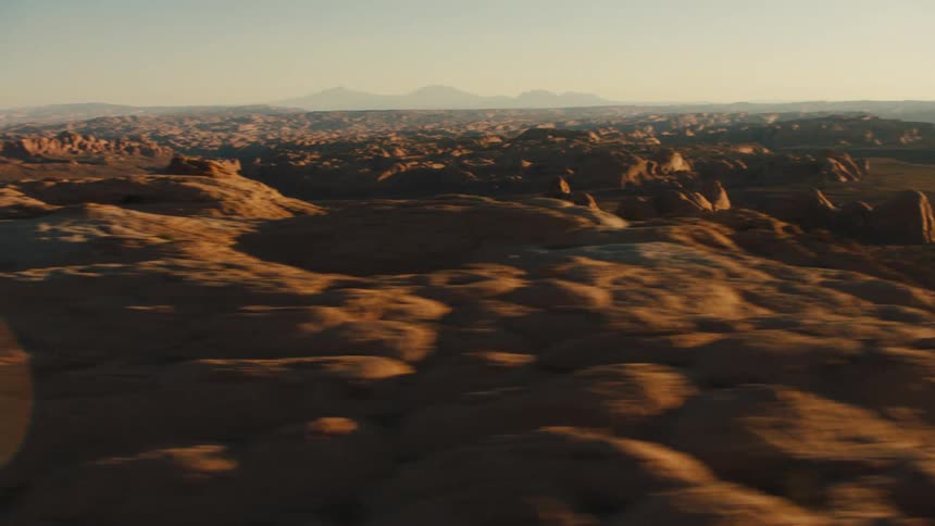 A mountain area is displayed at dusk