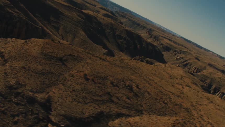 Aerial view of canyons and mesas in the badlands desert