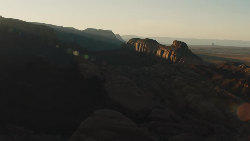 Sunset over the mesas and mountains of the desert badlands