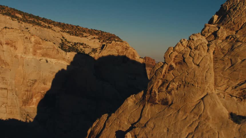 Aerial view of a canyon between mesas in the geological landscape of the badlands