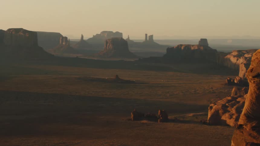 A desert with plateaus and the sky in the background