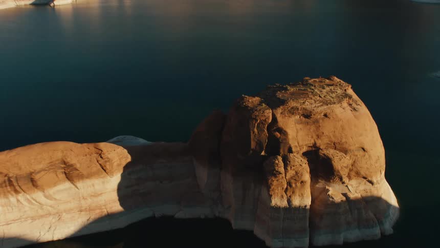 A lake with small rock islands jutting out of it