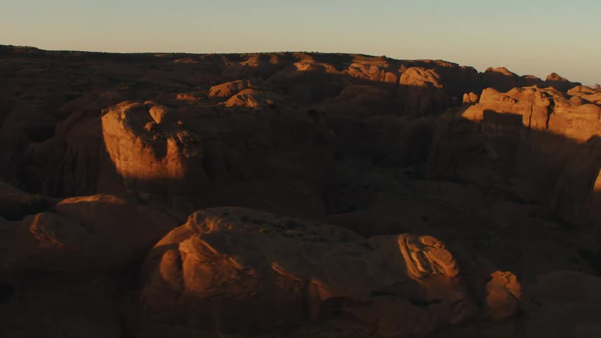 Rock formations in the desert at sunset