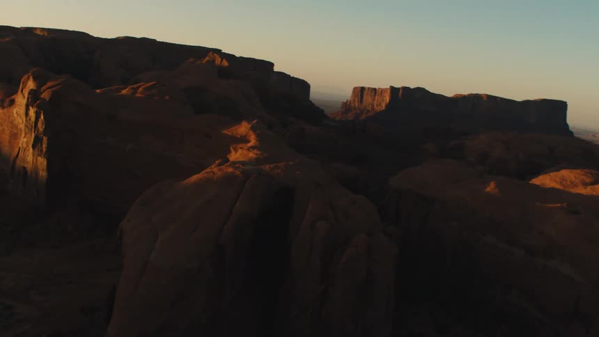 The tall canyon is covered with a sunny sky