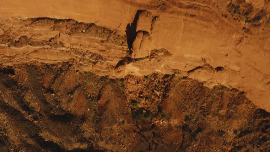 Shadows and light reveal and conceal texture slopes and crevices