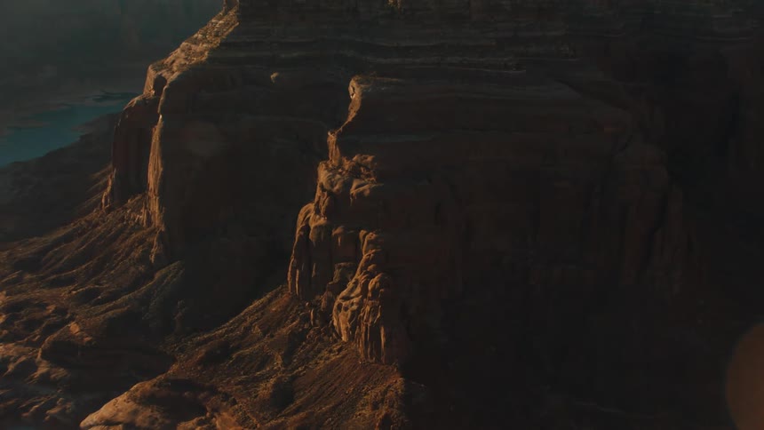 River flows through canyon bordering massive plateau