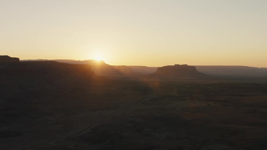 The sun breaking behind the mountains