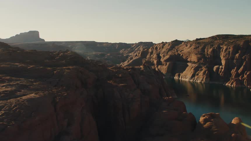 Aerial view of a river in a canyon through the mountains at the badlands desert